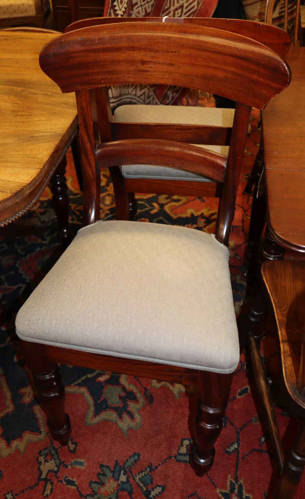 A set of eight Victorian-style mahogany dining chairs